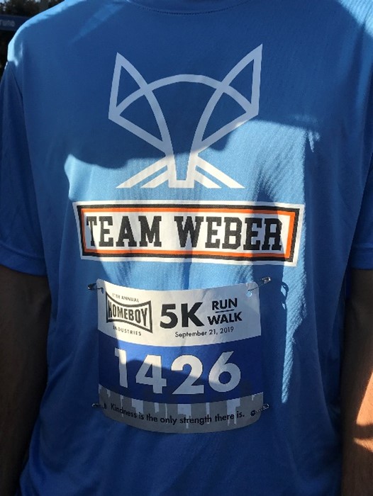 A member of Team Weber prepares for the Homeboy Industries 5k.
